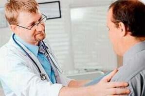A man with prostatitis in a doctor's appointment